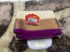 Folded fabric with a label on top of a digital scale on a textured surface