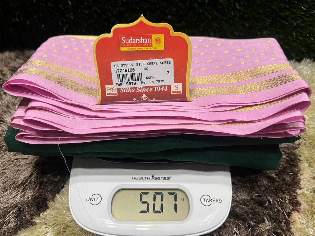Pink fabric with a label on top of a digital scale