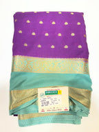Saree with a purple and green pattern on a white background