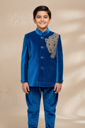 Boy wearing royal blue velvet bandhgala with leopard embroidery