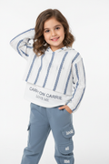 Girl wearing striped knit sweater and cargo pants