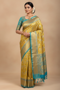 Indian Model in Gold Tissue Saree with Teal Border