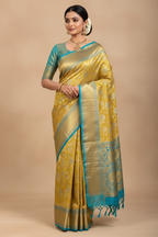 Indian Model in Gold Tissue Saree with Teal Border