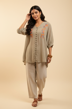 Indian model wearing beige floral embroidery crinkle tunic