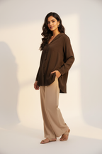 Indian model wearing dark brown sailor collar blouse with top buttons open
