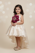 Kid wearing cream and magenta flower dress