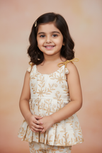 Kid wearing cream gold embroidered ethnic top