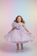 Kid wearing lavender party dress