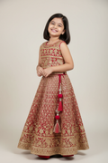 Kid wearing red gold lehenga
