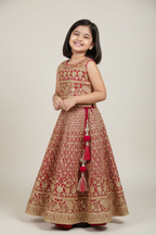 Kid wearing red gold lehenga