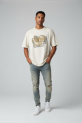 Male model in cream Amiri Hollywood t-shirt
