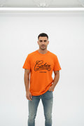 Male model in orange Calvin Klein t-shirt