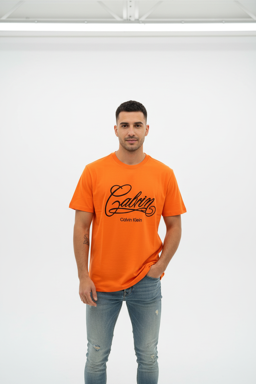 Male model in orange Calvin Klein t-shirt