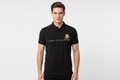 Male model wearing black polo with chest stripe and gold patch