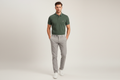 Male model wearing green polo shirt