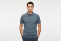 Male model wearing slate blue-grey polo