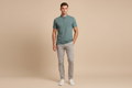 Male model wearing teal polo shirt