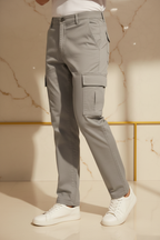 Model in aesthetic pose wearing grey cargo pants, lower body