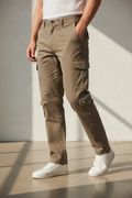 Model in aesthetic pose wearing khaki cargo pants, lower body