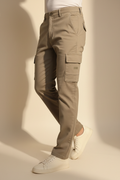 Model in aesthetic pose wearing taupe cargo pants, lower body