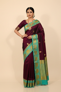 Model in Plum Kanjivaram Saree with Teal Border
