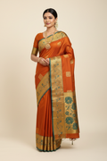 Model in Rust Orange Kanjivaram Saree with Gold Teal Border