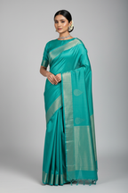 Model in Teal Plain Silk Saree
