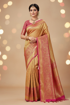 Model wearing all-gold Banarasi saree with magenta pink border