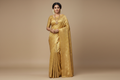 Model wearing Antique Gold Tissue Silk Saree