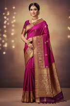 Model wearing bright magenta Kanchipuram silk saree with dark maroon gold zari border