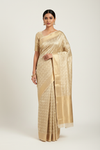 Model wearing champagne gold herringbone Banarasi saree