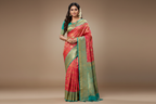 Model wearing Coral Red Kanjivaram Silk Saree with Turquoise Border