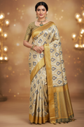Model wearing cream Banarasi saree with mustard yellow and teal border