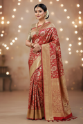 Model wearing crimson red Banarasi saree with antique gold border