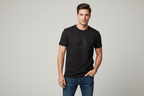 Model wearing dark charcoal geometric graphic t-shirt
