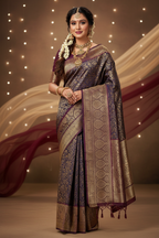 Model wearing dark navy Banarasi saree with maroon border and gold paisley