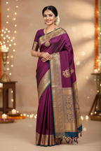 Model wearing deep wine purple Kanchipuram silk saree with grand antique gold zari Yali border