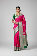 Model wearing hot pink Banarasi saree with silver green border