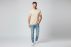 Model wearing light beige crew neck t-shirt