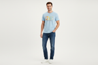 Model wearing light blue Levi's graphic t-shirt