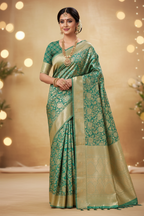 Model wearing mint green Banarasi saree with cream gold zari blouse