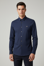 Model wearing navy blue eagle logo shirt