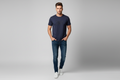 Model wearing navy blue embossed graffiti graphic t-shirt