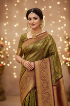 Model wearing olive green Banarasi saree with deep maroon border