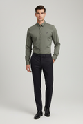 Model wearing olive green eagle logo shirt