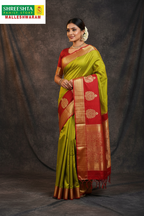 Model wearing Olive Green & Red Kanjivaram Saree