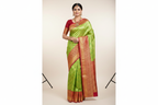 Model wearing Parrot Green Kanjivaram Silk Saree with Red Border