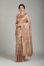 Model wearing rose-gold Banarasi tissue saree