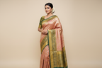 Model wearing Rose Gold Kanjivaram Silk Saree