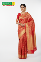 Model wearing Shreeshta red Kanjivaram saree with gold zari